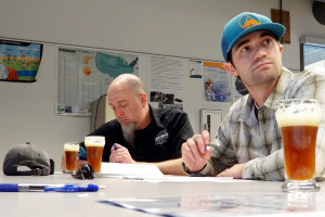 Pat Ringe, of Diamond Knot Brewing Co. (left) and Kevin Smith, of Bale Breaker Brewing Co., are served samples of Redrum Rye during the CWU Craft Brewing Program Competition on Thursday, May 22. The competition was sponsored by Diamond Knot, which will produce and distribute the winning beer — Jackrabbit Pale Ale. (Barb Arnott/CWU)